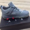 Jordan 4 Retro x KAWS Cool Grey